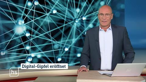 Moderator vor Bild mit Topthema